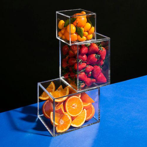 Clear cubes filled with fruit.